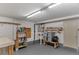 Well-equipped basement workshop with ample storage and workbenches at 210 Sun Vista N Ct # 61, Treasure Island, FL 33706