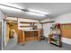 Clean and functional basement workshop with storage shelves at 210 Sun Vista N Ct # 61, Treasure Island, FL 33706