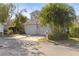 Two-car garage and lush landscaping at 2458 Alhambra St, Clearwater, FL 33761