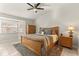 Spacious main bedroom with a king-size bed and wood armoire at 2458 Alhambra St, Clearwater, FL 33761