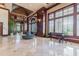 Spacious lobby with seating, large windows, and a piano at 345 Bayshore Blvd # 1603, Tampa, FL 33606