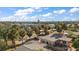 Aerial view of a house with a gray roof and a backyard patio at 3863 Belle Vista E Dr, St Pete Beach, FL 33706