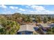 Aerial view of the house, highlighting its light blue exterior and gray roof at 3863 Belle Vista E Dr, St Pete Beach, FL 33706
