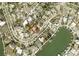 Aerial view showcasing the property's waterfront location and proximity to neighbors at 3863 Belle Vista E Dr, St Pete Beach, FL 33706