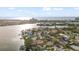 Wide aerial showcasing waterfront homes and the Gulf of Mexico at 3863 Belle Vista E Dr, St Pete Beach, FL 33706