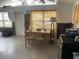 Small dining area with a wooden table and two chairs near kitchen at 3863 Belle Vista E Dr, St Pete Beach, FL 33706