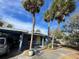 Charming single story home with carport, palm trees, and landscaped yard at 3863 Belle Vista E Dr, St Pete Beach, FL 33706