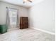 Bedroom with hardwood floors, window, and ample space for relaxation and decor at 3901 Tour Trce, Land O Lakes, FL 34638