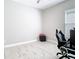Bright room with pale walls, offering a clean design, accented by a modern gaming chair and streaming setup at 3901 Tour Trce, Land O Lakes, FL 34638