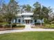 Exterior of the fitness center, showcasing its welcoming entrance, landscaping, and blue exterior at 3901 Tour Trce, Land O Lakes, FL 34638