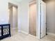 Hallway view of the shower with tile surround, modern fixtures, and tile floor at 3901 Tour Trce, Land O Lakes, FL 34638
