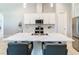 Bright, open kitchen with a large island, quartz countertops, and stainless steel appliances at 3901 Tour Trce, Land O Lakes, FL 34638