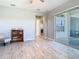 Light-filled living area with tile floors and a sliding door to the outside patio at 3901 Tour Trce, Land O Lakes, FL 34638