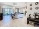 Open concept floor plan featuring a modern kitchen, spacious living room, and access to outdoor patio at 3901 Tour Trce, Land O Lakes, FL 34638