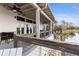Covered outdoor patio offering comfortable seating and scenic views of the adjacent lake at 3901 Tour Trce, Land O Lakes, FL 34638