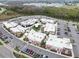 Aerial view of a modern shopping center with ample parking and a variety of retailers in Land O' Lakes, Florida at 3901 Tour Trce, Land O Lakes, FL 34638