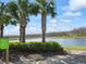 Scenic walking trail along a peaceful lake surrounded by lush vegetation and natural beauty at 3901 Tour Trce, Land O Lakes, FL 34638