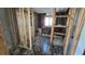 Bathroom renovation in progress featuring wood frame walls, window, and tiled floor at 4659 Helena Ne St, St Petersburg, FL 33703
