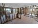 Unfinished living space with exposed framing and a sliding glass door providing natural light at 4659 Helena Ne St, St Petersburg, FL 33703