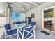 Outdoor patio with comfortable seating, ceiling fan and an adjacent outdoor pool at 4659 Helena Ne St, St Petersburg, FL 33703