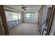 Sun room undergoing renovation with large windows providing natural light and newly tiled floors at 4659 Helena Ne St, St Petersburg, FL 33703