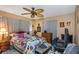 Bedroom with floral bedding and ceiling fan at 904 Normandy Rd, Clearwater, FL 33764