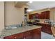 Well-equipped kitchen featuring granite countertops and dark wood cabinetry at 904 Normandy Rd, Clearwater, FL 33764