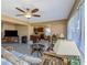 Bright living room features a view into the kitchen and lots of natural light at 904 Normandy Rd, Clearwater, FL 33764