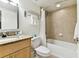 Bathroom with tub, shower, toilet and granite vanity at 11605 Gulf Blvd # 507, Treasure Island, FL 33706