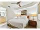 Bedroom with queen bed, nightstands and ceiling fan at 11605 Gulf Blvd # 507, Treasure Island, FL 33706