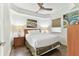 Bedroom with queen bed, wood floors and ceiling fan at 11605 Gulf Blvd # 507, Treasure Island, FL 33706