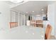 Dining area features a glass-top table and four chairs at 11605 Gulf Blvd # 507, Treasure Island, FL 33706