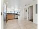 Modern kitchen with stainless steel appliances and light wood cabinets at 11605 Gulf Blvd # 507, Treasure Island, FL 33706