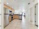 Modern kitchen with stainless steel appliances and light wood cabinets at 11605 Gulf Blvd # 507, Treasure Island, FL 33706