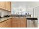 Kitchen boasts granite countertops and light wood cabinets at 11605 Gulf Blvd # 507, Treasure Island, FL 33706
