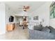 Spacious living room with comfortable seating and a large TV at 11605 Gulf Blvd # 507, Treasure Island, FL 33706