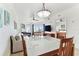 Living room offers a sofa, chairs, and a view from sliding doors at 11605 Gulf Blvd # 507, Treasure Island, FL 33706