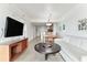 Open concept living area with sofa, coffee table, and dining area at 11605 Gulf Blvd # 507, Treasure Island, FL 33706