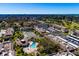 Aerial view of community, pool, tennis, and parking at 12300 Vonn Rd # 9205, Largo, FL 33774