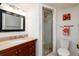 Clean bathroom with shower, toilet and granite countertop vanity at 12300 Vonn Rd # 9205, Largo, FL 33774