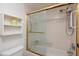 Bathroom with shower/tub combo, and gold-framed glass door at 12300 Vonn Rd # 9205, Largo, FL 33774