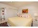 Spacious bedroom with king-size bed, ensuite bathroom access, and hardwood floors at 12300 Vonn Rd # 9205, Largo, FL 33774
