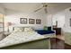 Guest bedroom with a green sleigh bed and a daybed, ensuite bathroom at 12300 Vonn Rd # 9205, Largo, FL 33774