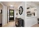 Condo entryway with tile flooring and view into kitchen at 12300 Vonn Rd # 9205, Largo, FL 33774
