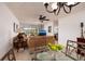 Living room with brown sofas, glass coffee table, and view of lanai at 12300 Vonn Rd # 9205, Largo, FL 33774