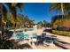 Inviting pool area with lounge chairs and patio tables at 12300 Vonn Rd # 9205, Largo, FL 33774