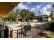Community pool with adjacent grilling station at 12300 Vonn Rd # 9205, Largo, FL 33774