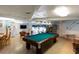 Relaxing recreation room with a pool table and TV at 12300 Vonn Rd # 9205, Largo, FL 33774