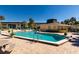 Community pool with surrounding patio deck at 12300 Vonn Rd # 9205, Largo, FL 33774