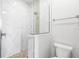 Modern bathroom with a walk-in shower and marble tile at 15136 Hennipen Cir, Port Charlotte, FL 33981